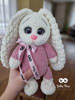 A milky white rabbit in a pink pijama