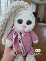 A milky white rabbit in a pink pijama - Image 2