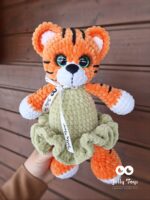 Tiger girl in pistachio colored dress. Gift box with name and date of birth