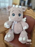 A light brown dragon with a name and date of birth is the symbol of the year 2024